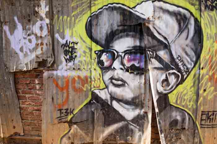 Monochrome portrait street art of Ali Oneway by Akill in Aadarsh Nagar, Marol area of Mumbai