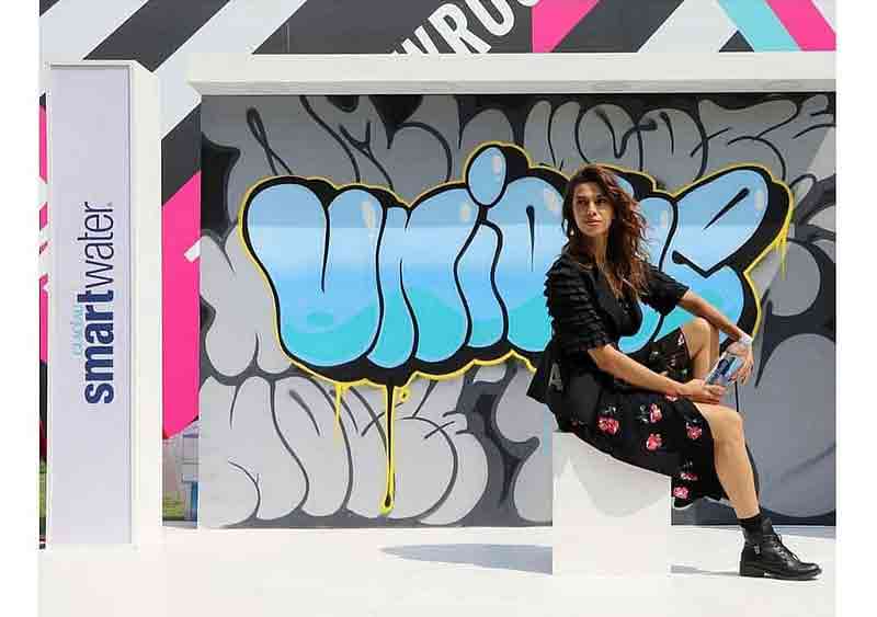 model posing at live graffiti for lakme fashion smart water event